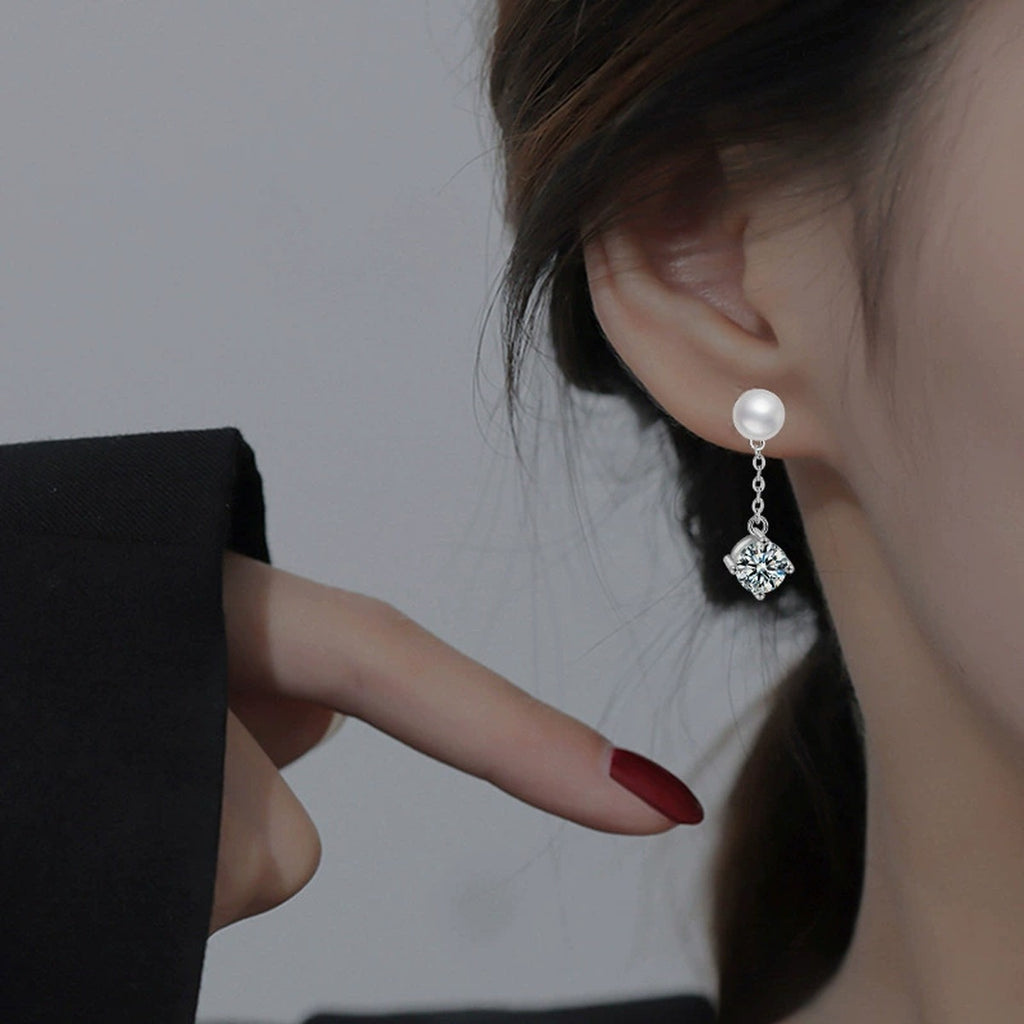 Pearl Round Moissanite Stud Dangle Earrings in White Gold-Plated S925 sterling silver worn on ear by model showing scale, placement, and stud dangle earrings styling