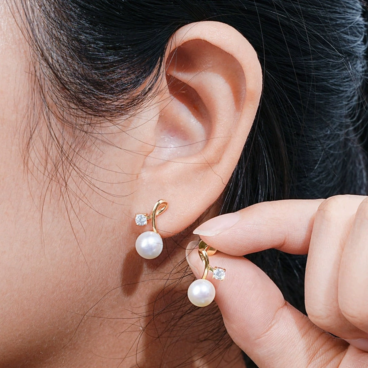 Pearl Round Moissanite Stud Drop Earrings in Gold-Plated S925 sterling silver worn on ear by model showing scale, placement, and stud drop earrings styling