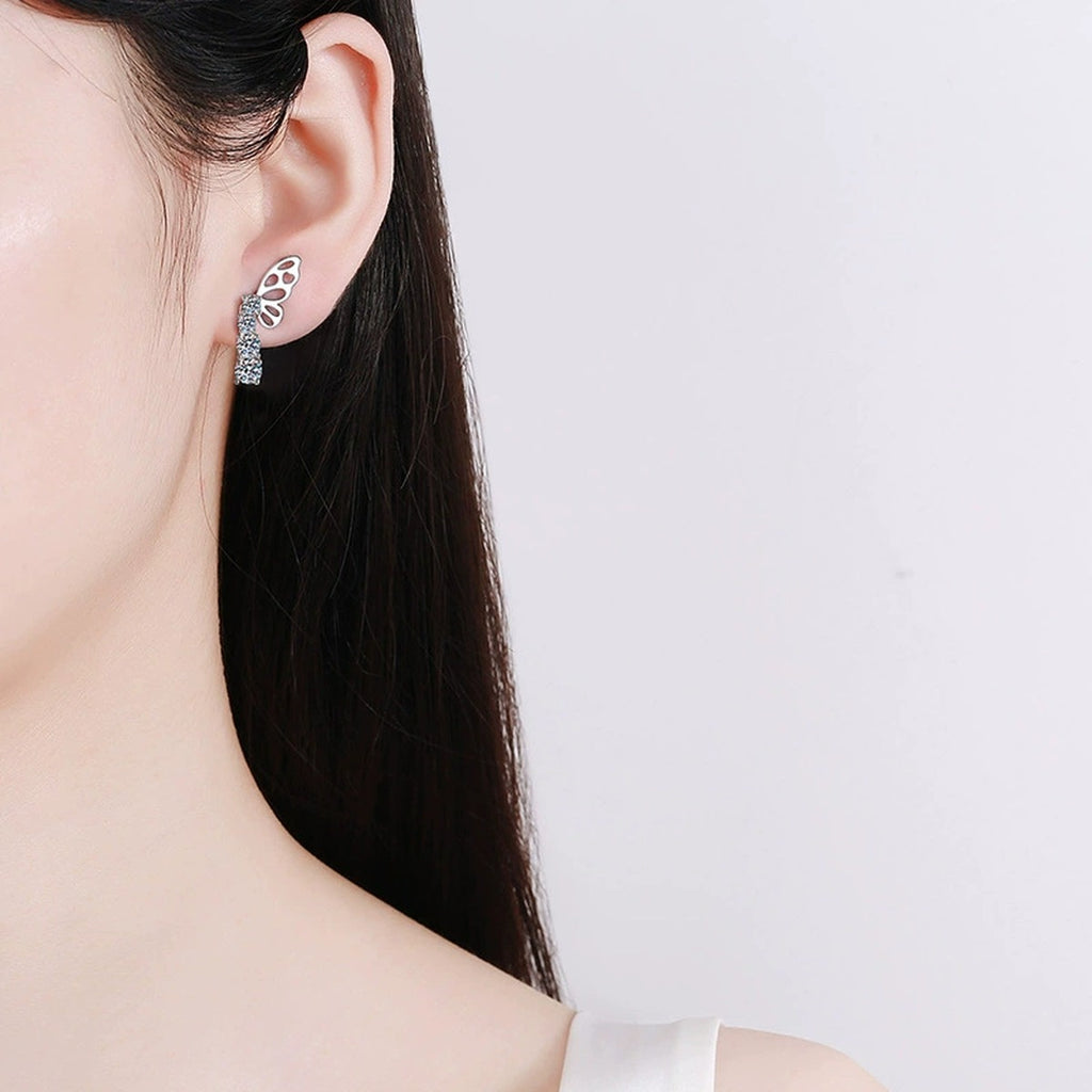 Butterfly Graduated Round Moissanite Stud Dangle Earrings in Gold-Plated S925 sterling silver worn on ear by model showing scale, placement, and stud dangle earrings styling