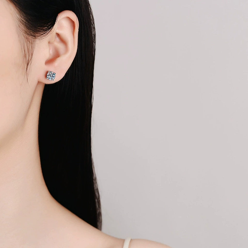 Four-Prong Round Moissanite and Mystic Stone Stud Earrings in S925 sterling silver worn on ear by model showing scale, placement, and stud earrings styling