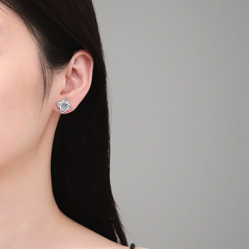 Four-Leaf Clover Round Moissanite Stud Earrings with CZ in Gold-Plated S925 sterling silver worn on ear by model showing scale, placement, and stud earrings styling