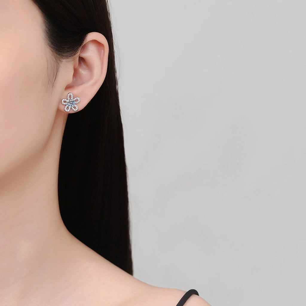 Sunflower Round Moissanite Stud Earrings with CZ in Gold-Plated S925 sterling silver worn on ear by model showing scale, placement, and stud earrings styling