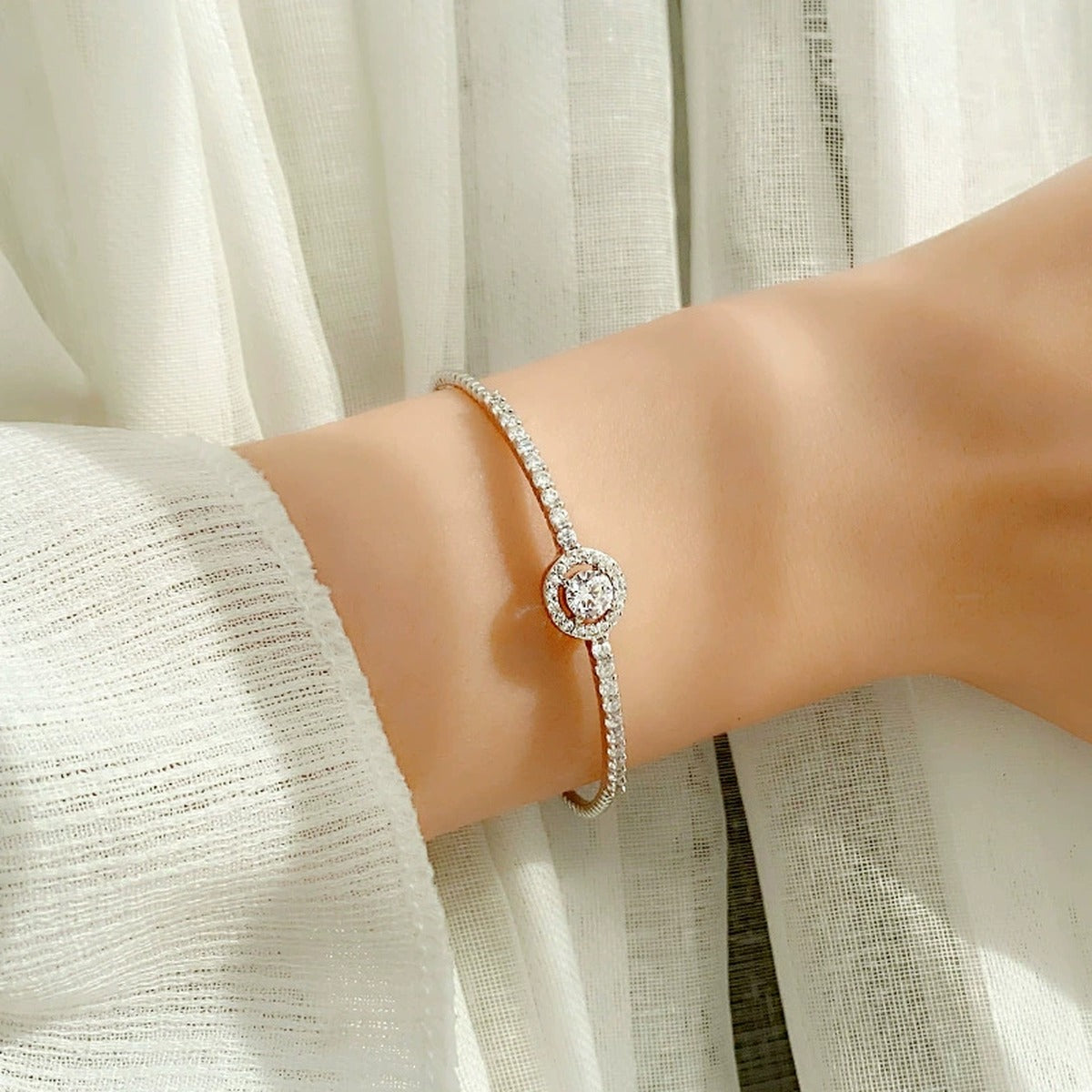 Round Halo Moissanite Bangle Bracelet with CZ in Gold-Plated S925 sterling silver worn on wrist model view showing scale and adjustable fit