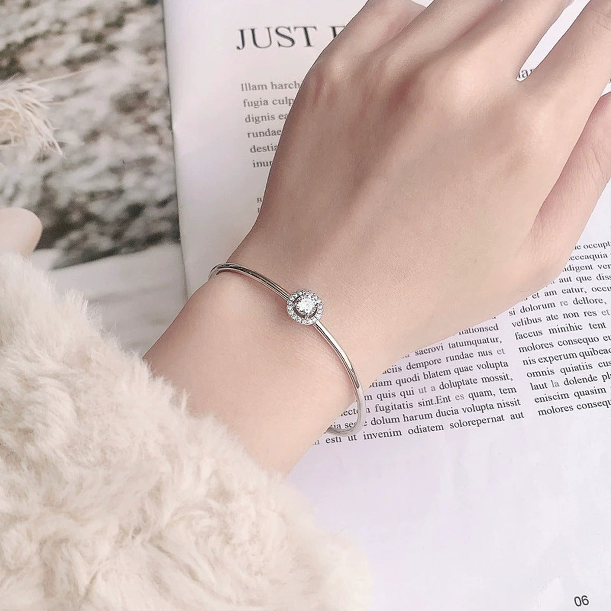 Round Halo Moissanite Adjustable Bangle with CZ in White Gold-Plated S925 sterling silver worn on wrist model view showing scale and adjustable fit