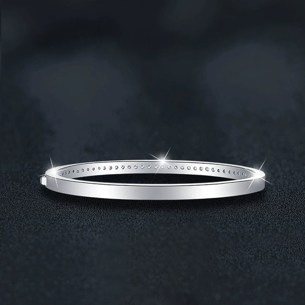 Round Moissanite Eternity Bangle in White Gold-Plated S925 sterling silver angled product display showing bracelet silhouette