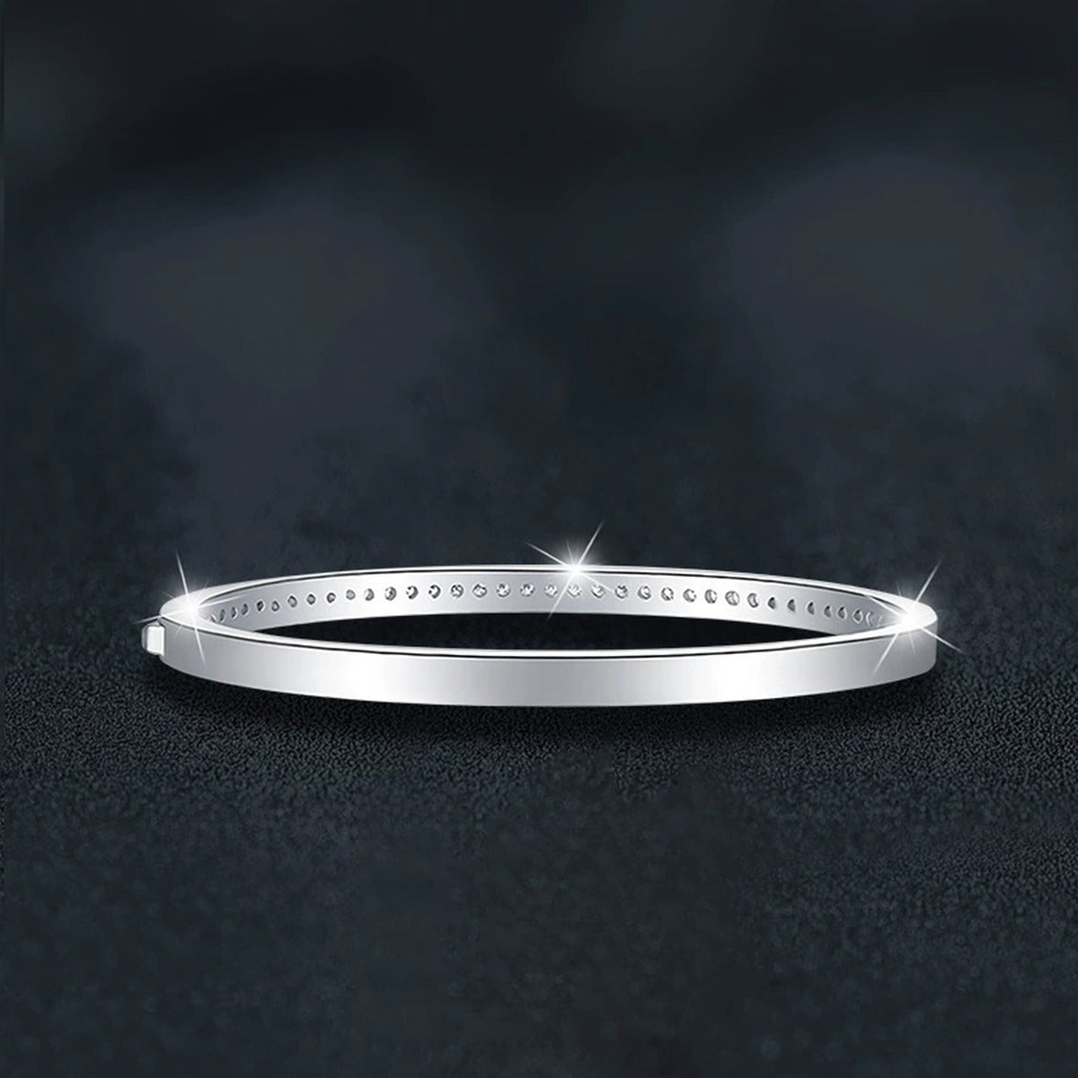 Round Moissanite Eternity Bangle in White Gold-Plated S925 sterling silver angled product display showing bracelet silhouette