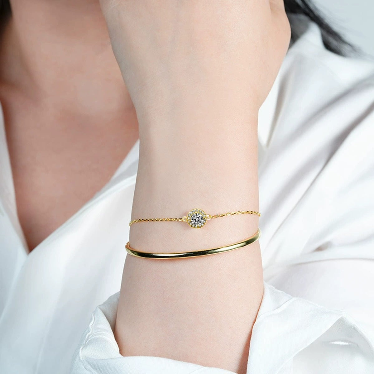 Round Halo Moissanite Chain Bangle with CZ in Gold-Plated S925 sterling silver worn on wrist model view showing scale and adjustable fit