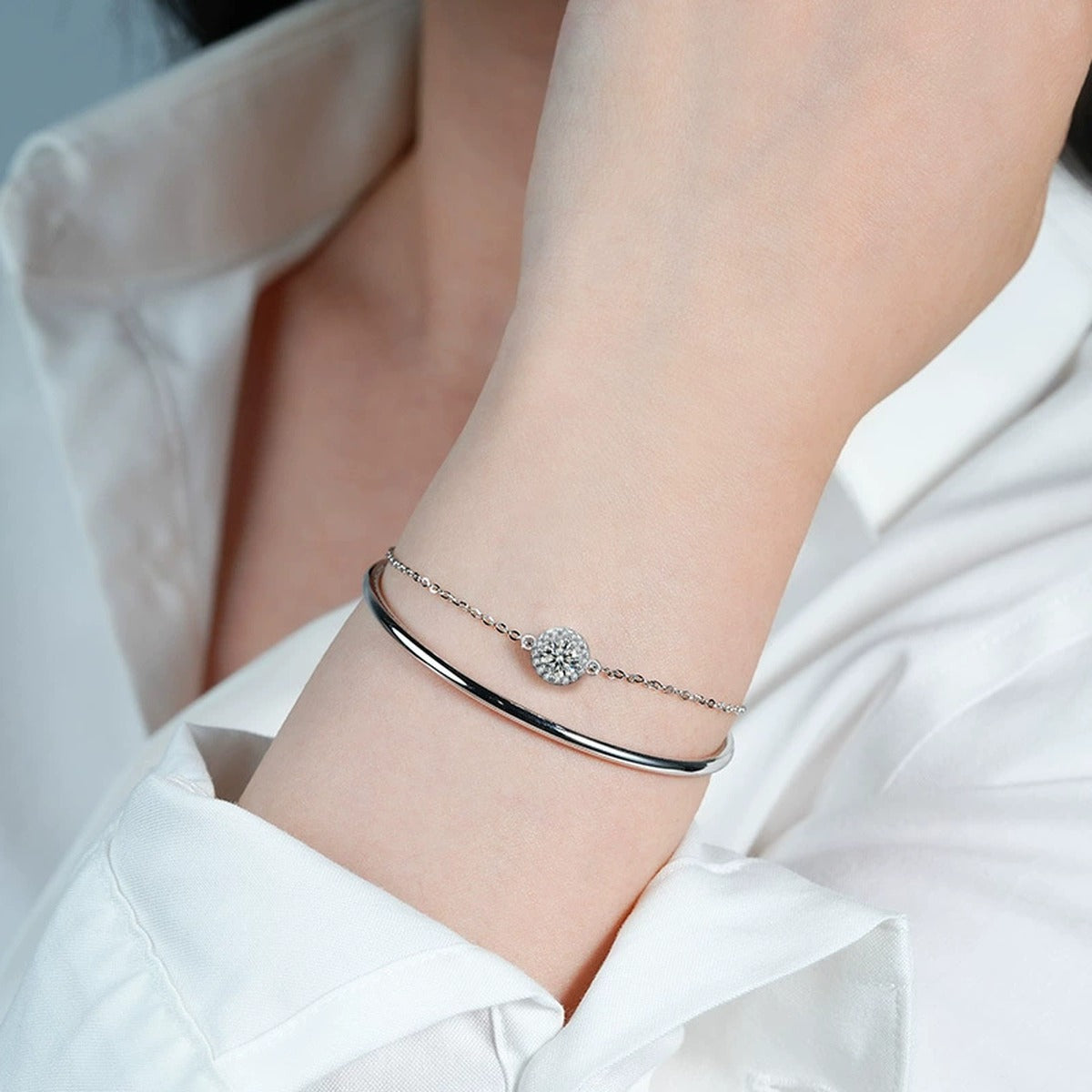 Round Halo Moissanite Chain Bangle with CZ in Gold-Plated S925 sterling silver worn on wrist model view showing scale and adjustable fit