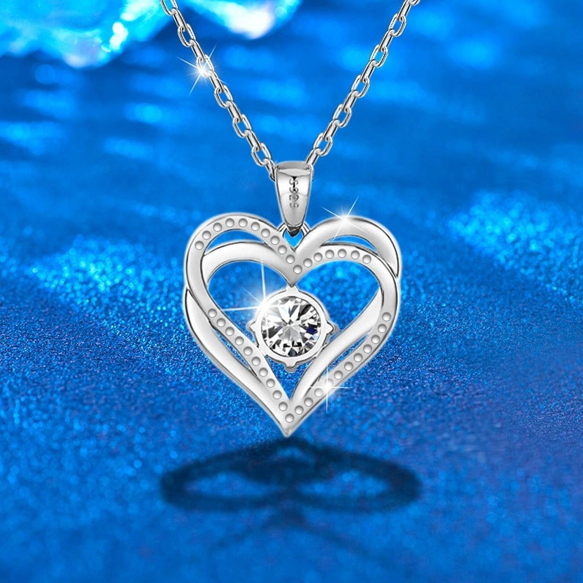 Interlocking Heart Colored Moissanite Necklace with CZ in White Gold-Plated S925 sterling silver close-up product scene showing pendant setting