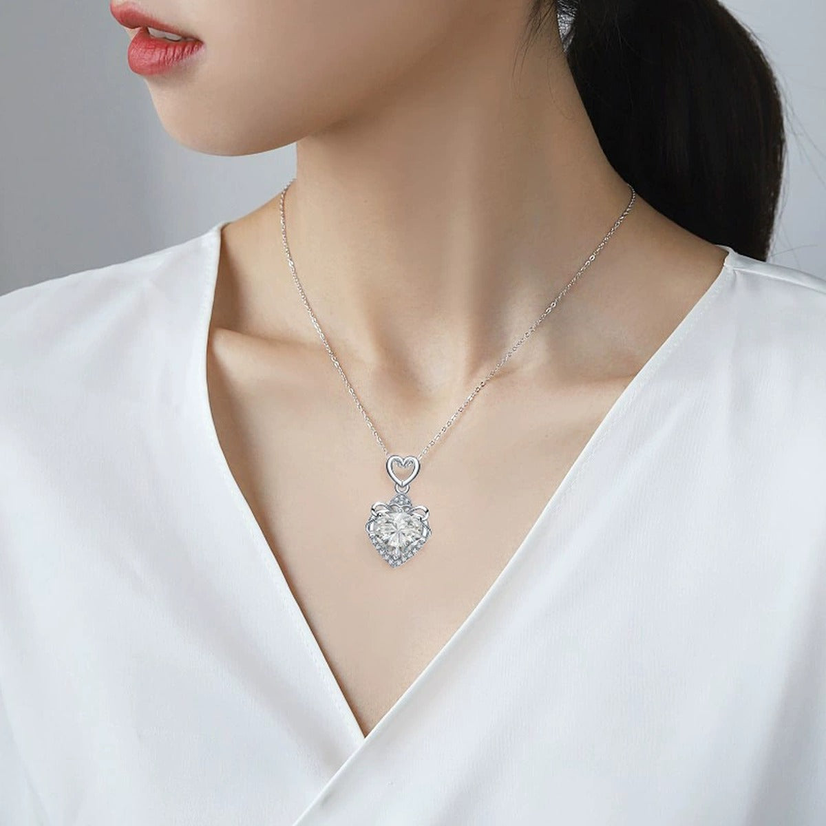 Heart Cut Moissanite Necklace with CZ in White Gold-Plated S925 sterling silver neckline model view showing pendant scale and chain length