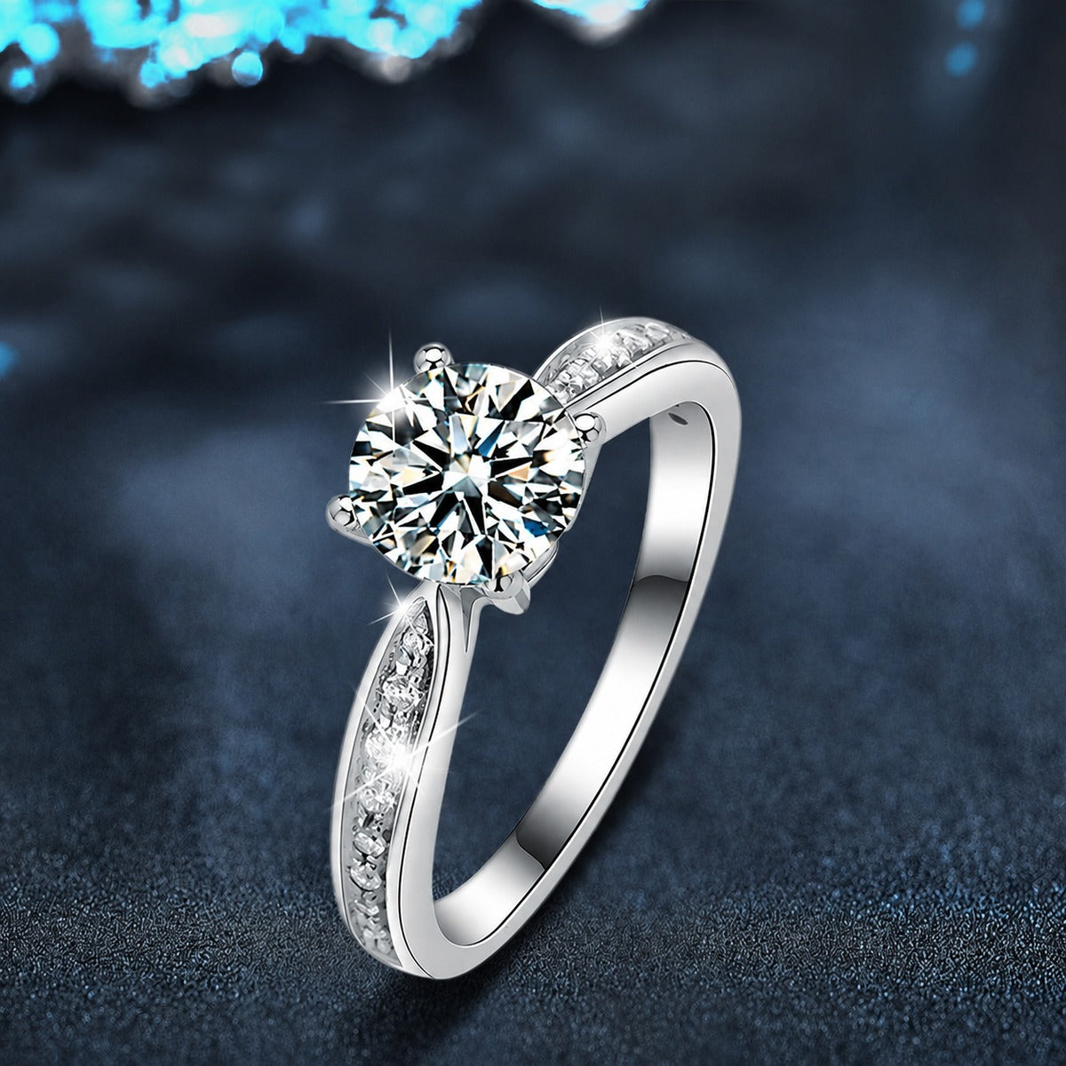 Four-Prong Round Moissanite Engagement Ring with CZ close-up detail view with moissanite sparkle