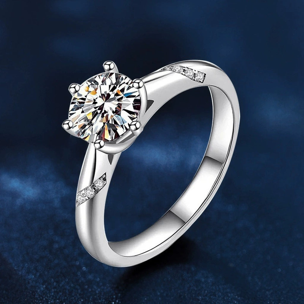 Six-Prong Round Moissanite Leaf Engagement Ring with CZ close-up detail view with moissanite sparkle