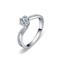 Twist Six-Prong Round Moissanite Engagement Ring with CZ in white gold-plated S925 sterling silver on clean white background