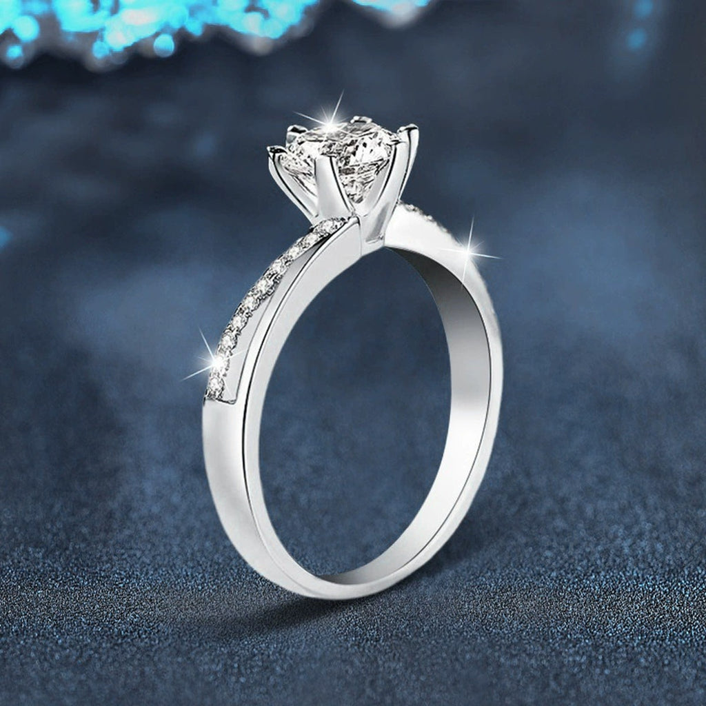 Twist Six-Prong Round Moissanite Engagement Ring with CZ close-up detail view with moissanite sparkle