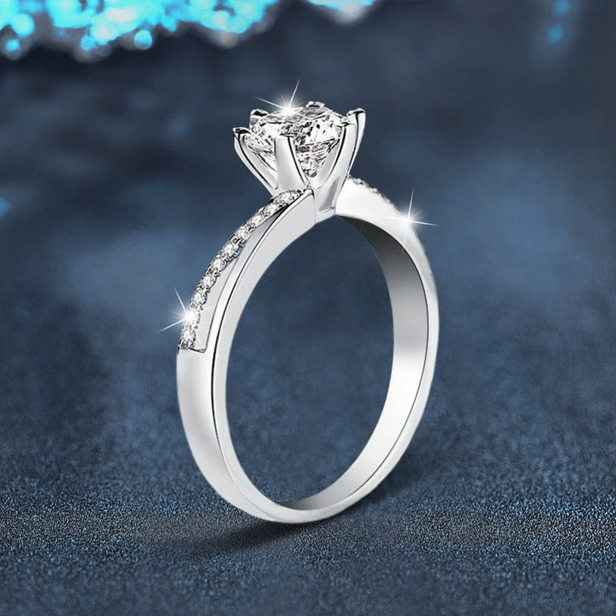 Twist Six-Prong Round Moissanite Engagement Ring with CZ close-up detail view with moissanite sparkle