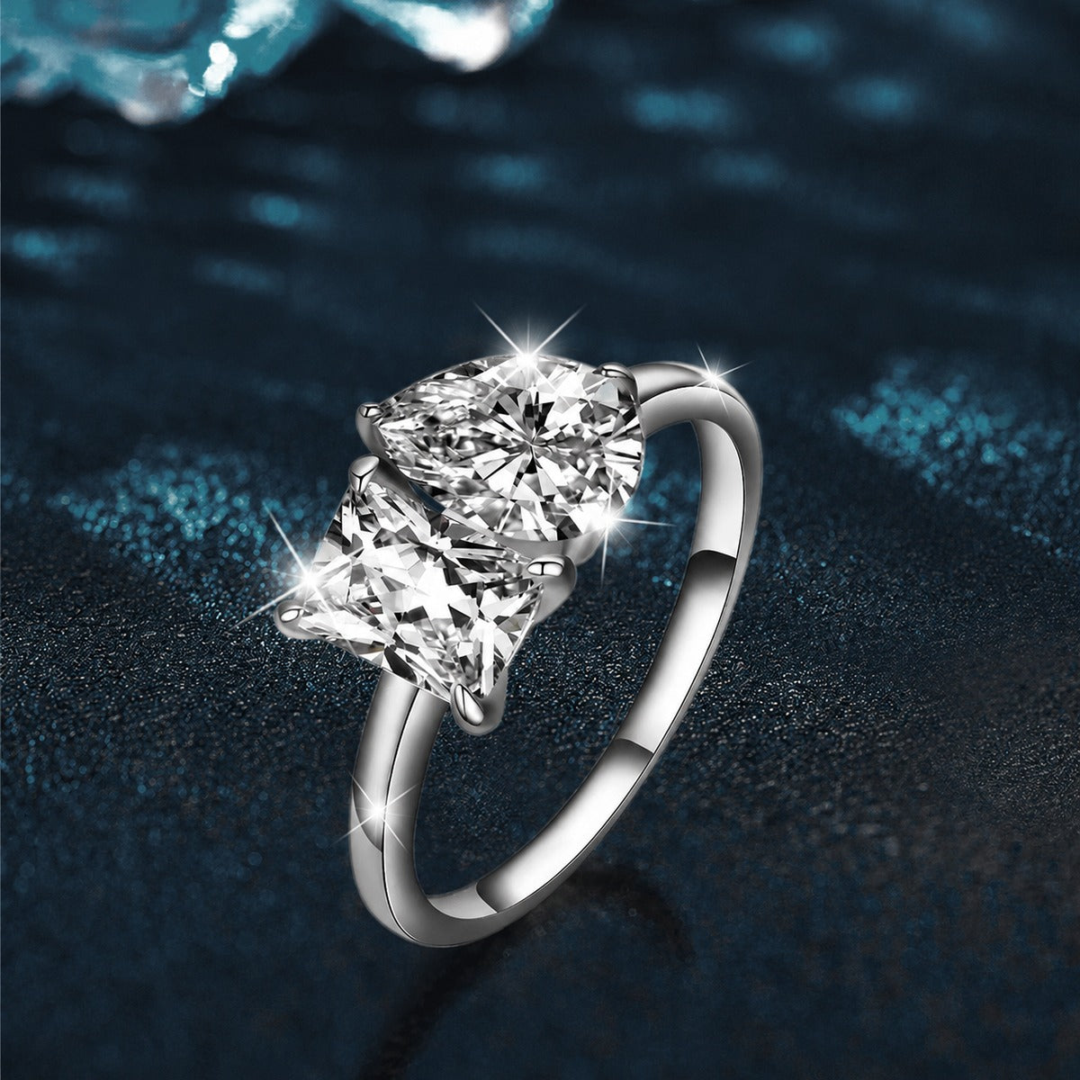 Radiant and Pear Cut Moissanite Toi et Moi Engagement Ring close-up detail view with moissanite sparkle