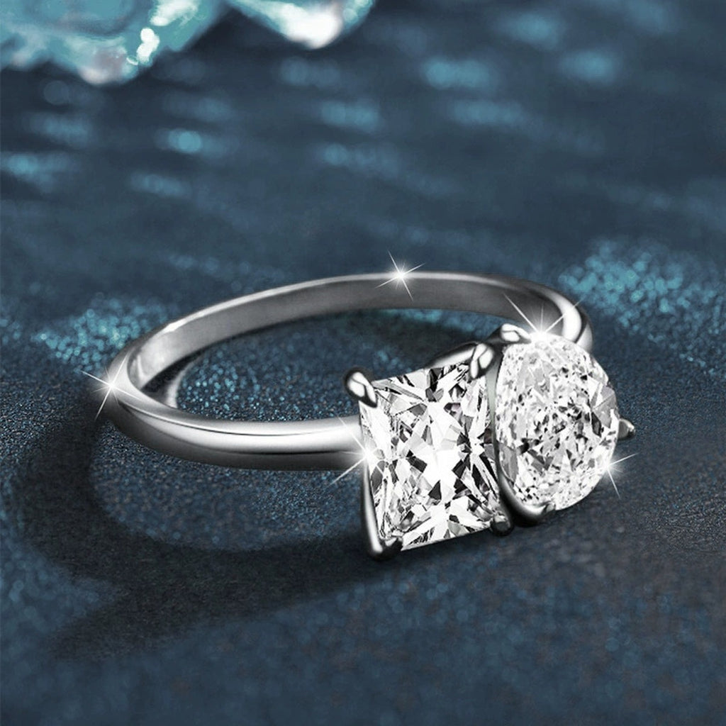 Radiant and Pear Cut Moissanite Toi et Moi Engagement Ring close-up detail view with moissanite sparkle