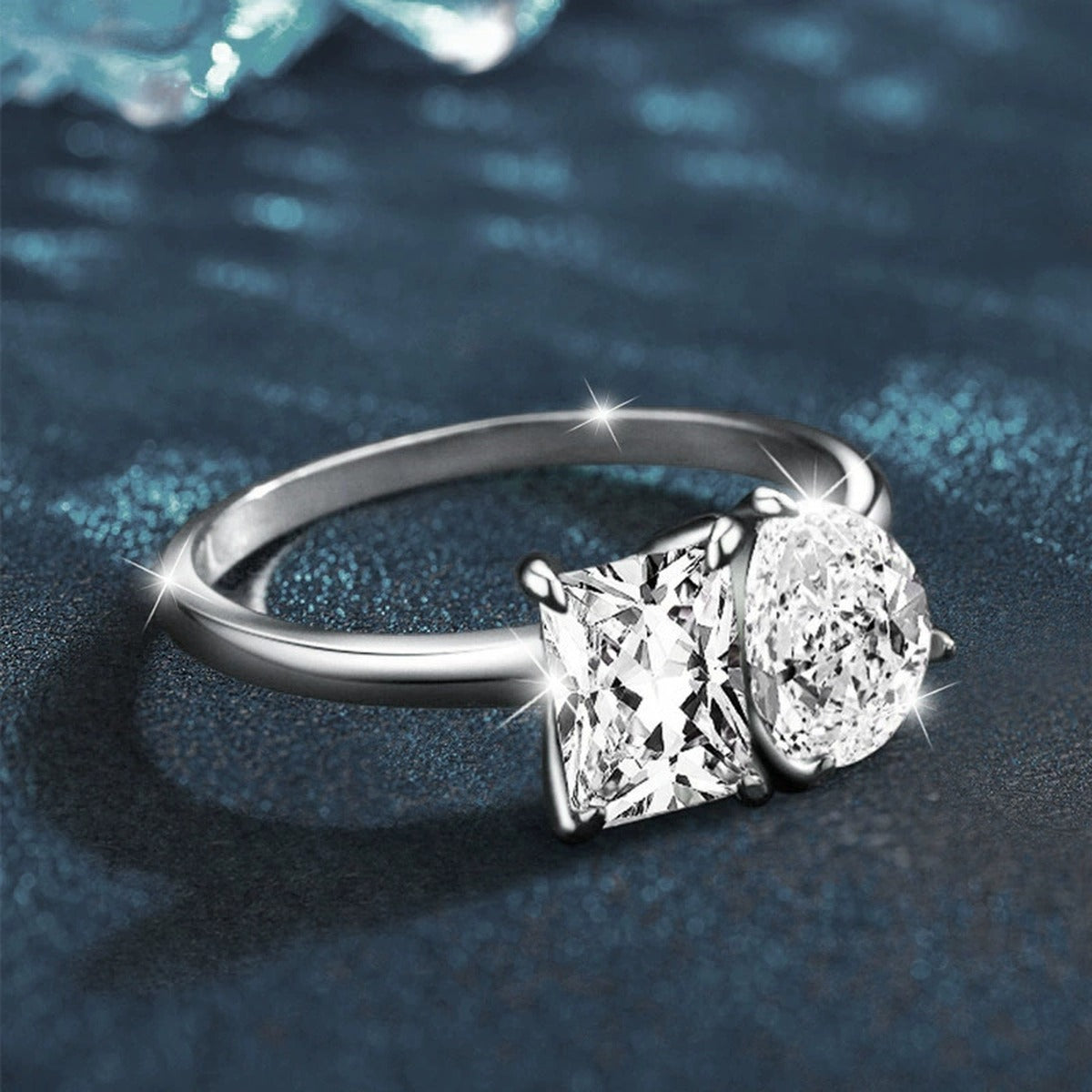 Radiant and Pear Cut Moissanite Toi et Moi Engagement Ring close-up detail view with moissanite sparkle