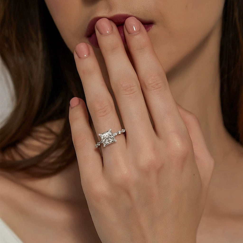 Princess Cut Moissanite Engagement Ring with CZ worn on hand to show scale, band width, and ring profile