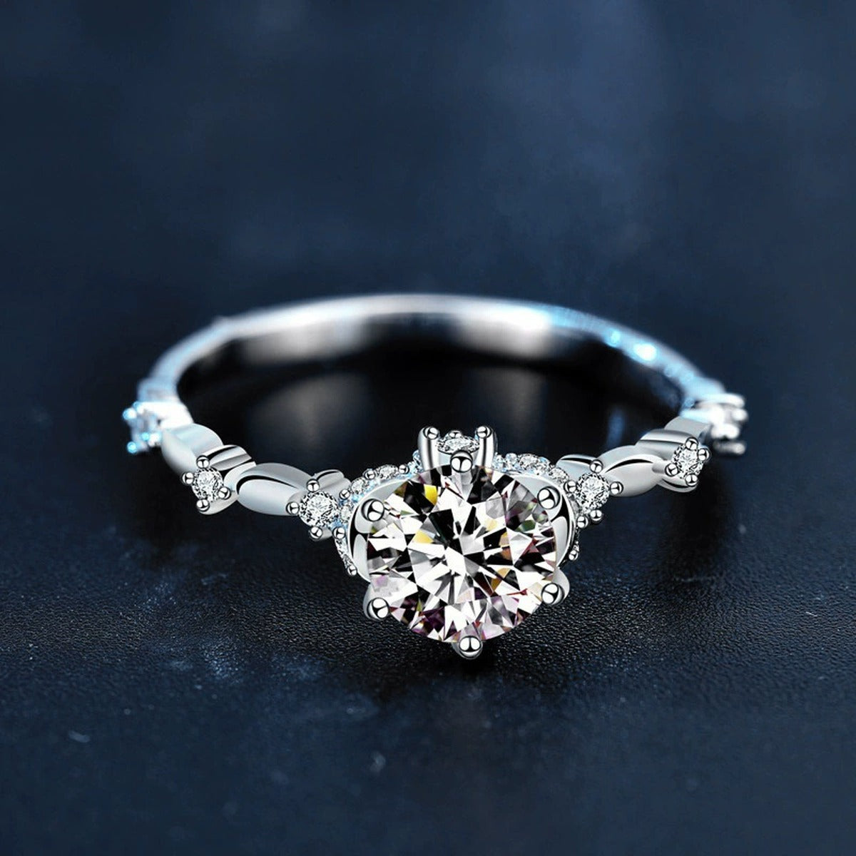 Six-Prong Round Moissanite Engagement Ring with CZ product view showing moissanite setting and metal finish