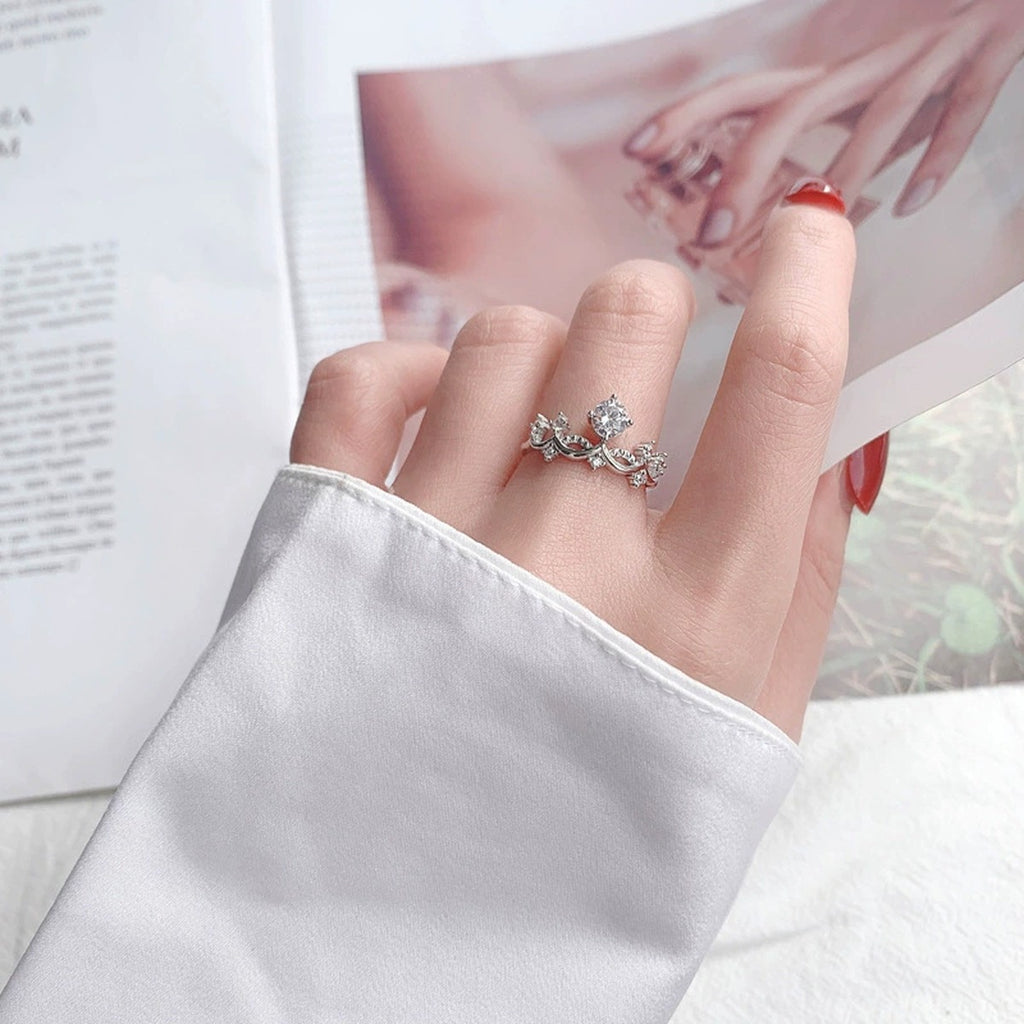 Princess and Knight Couples Round Moissanite Wedding Rings with CZ worn on hand to show scale, band width, and ring profile