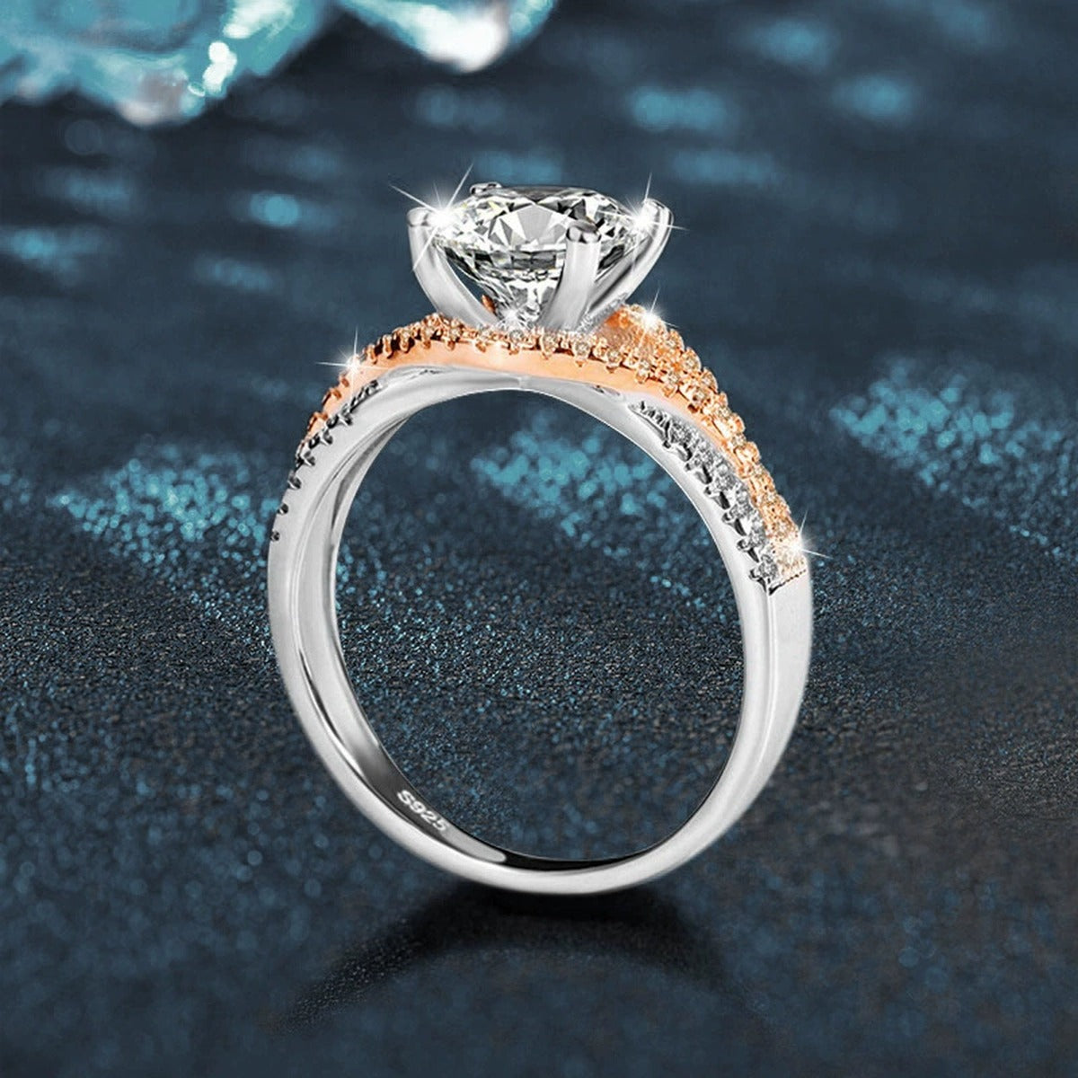 Four-Prong Round Moissanite Engagement Ring with CZ close-up detail view with moissanite sparkle