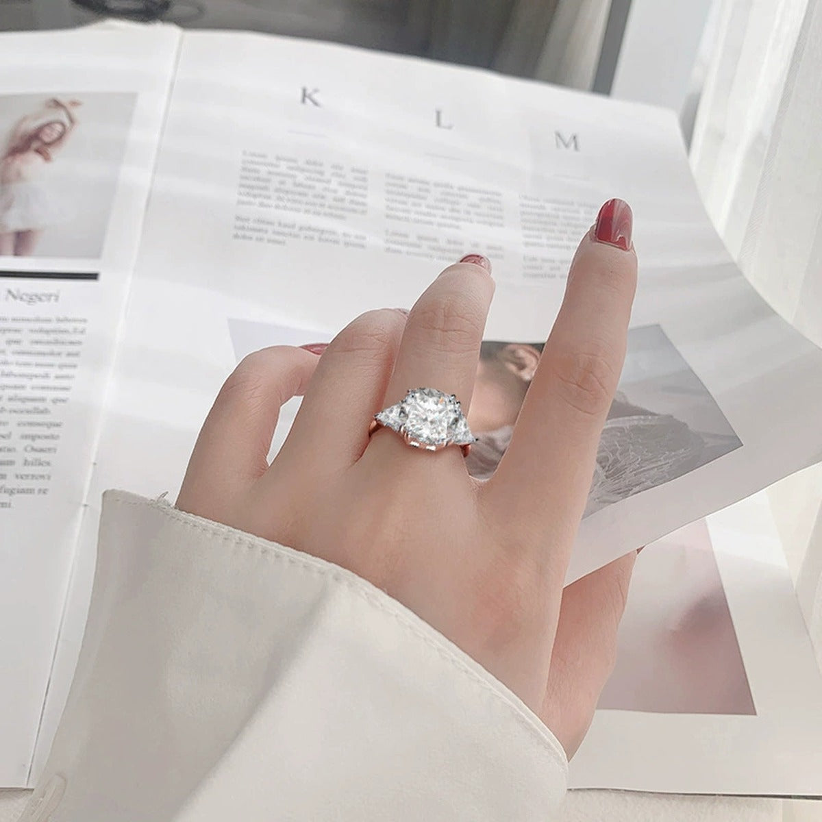 Oversized Round Moissanite Engagement Ring worn on hand to show scale, band width, and ring profile