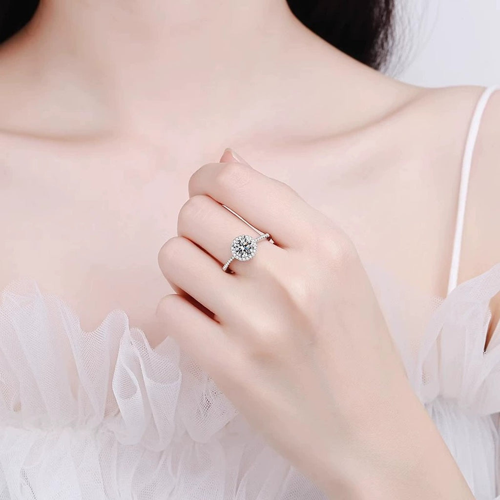 Round Halo Moissanite Adjustable Engagement Ring with CZ worn on hand to show scale, band width, and ring profile