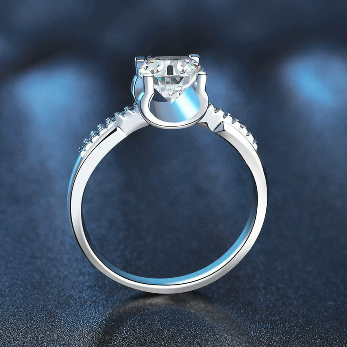 Four-Prong Round Moissanite Engagement Ring with CZ product view showing moissanite setting and metal finish
