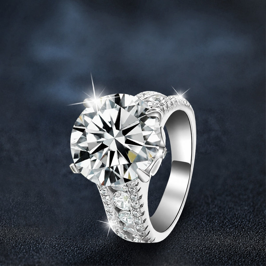 Oversized Four-Prong Round Moissanite Engagement Ring with CZ close-up detail view with moissanite sparkle