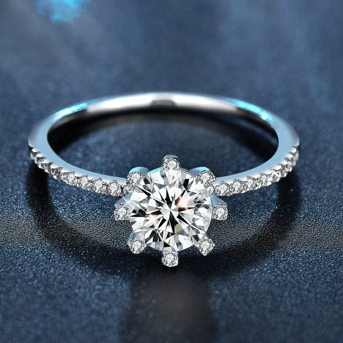 Eight-Prong Round Moissanite Engagement Ring with CZ close-up detail view with moissanite sparkle