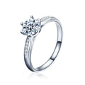 Six-Prong Round Moissanite Engagement Ring with CZ in white gold-plated S925 sterling silver on clean white background
