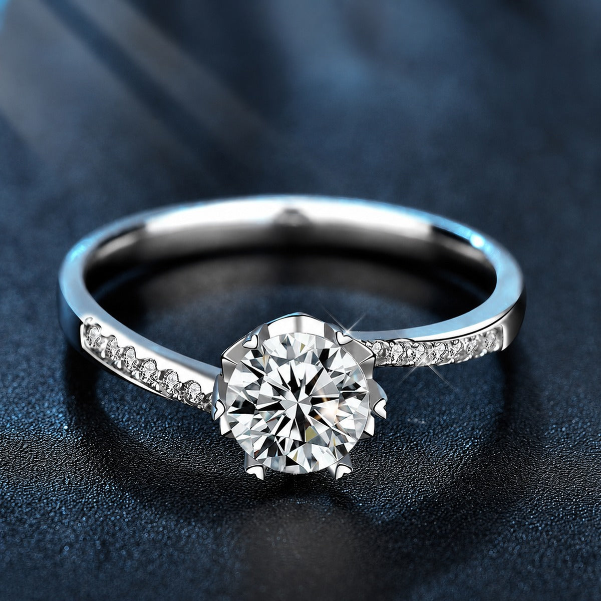 Six-Prong Round Moissanite Engagement Ring with CZ close-up detail view with moissanite sparkle