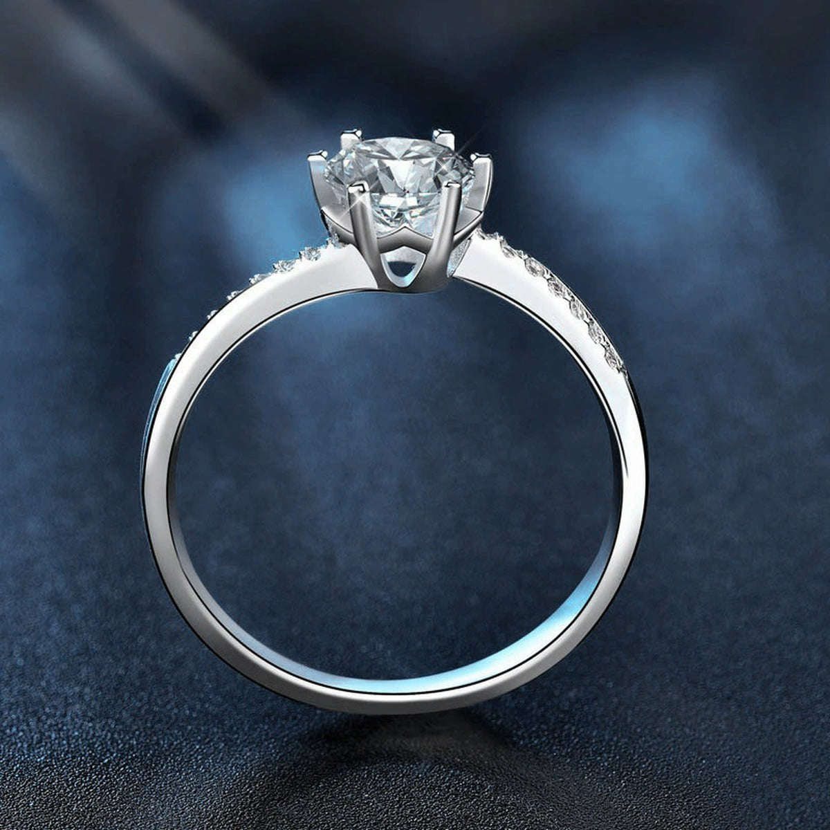 Six-Prong Round Moissanite Engagement Ring with CZ close-up detail view with moissanite sparkle