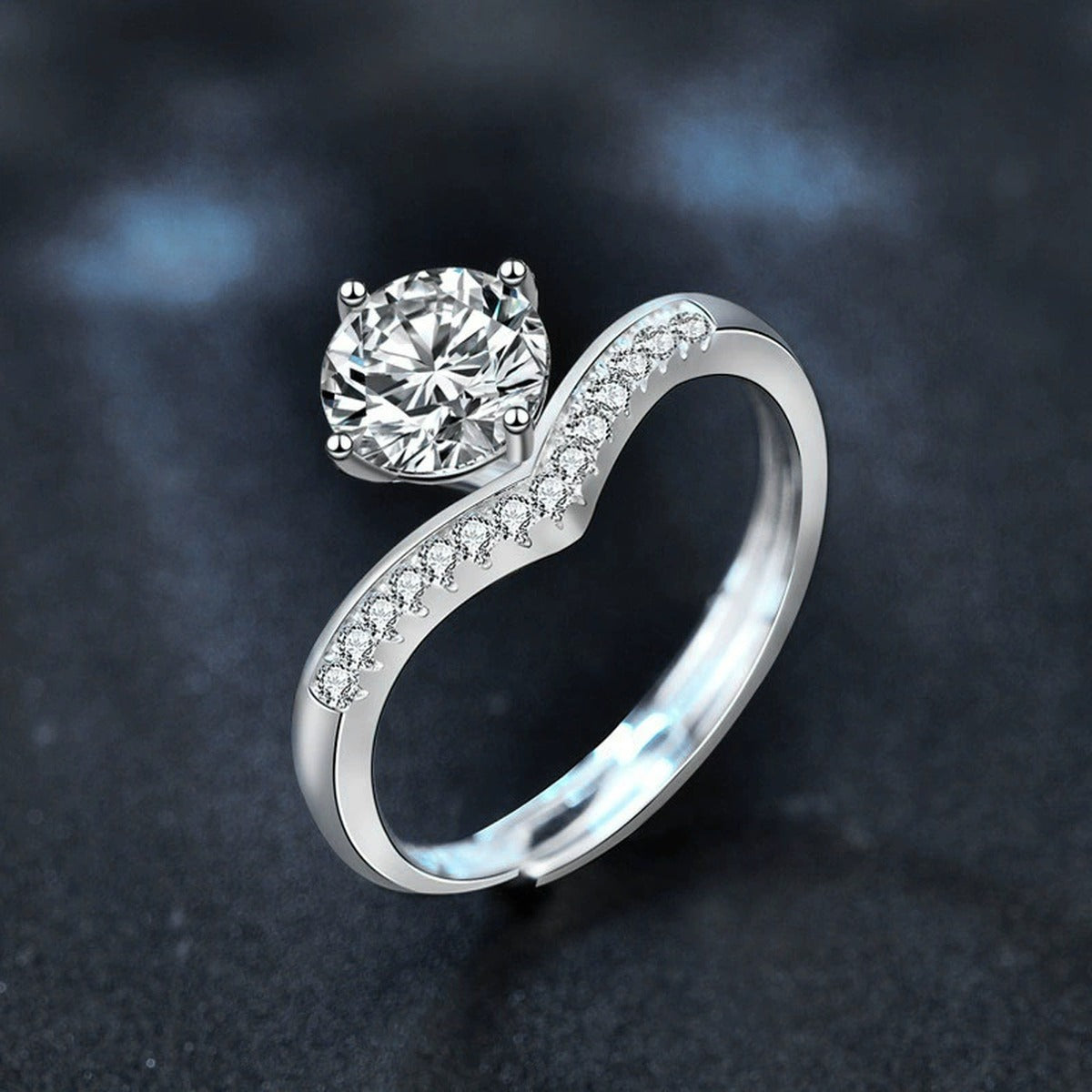 Four-Prong Round Moissanite Adjustable Engagement Ring with CZ close-up detail view with moissanite sparkle