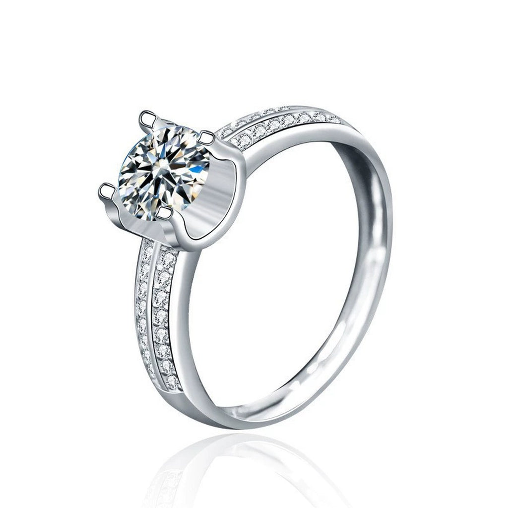 Four-Prong Round Moissanite Engagement Ring with CZ in white gold-plated S925 sterling silver on clean white background