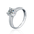 Four-Prong Round Moissanite Engagement Ring with CZ in white gold-plated S925 sterling silver on clean white background