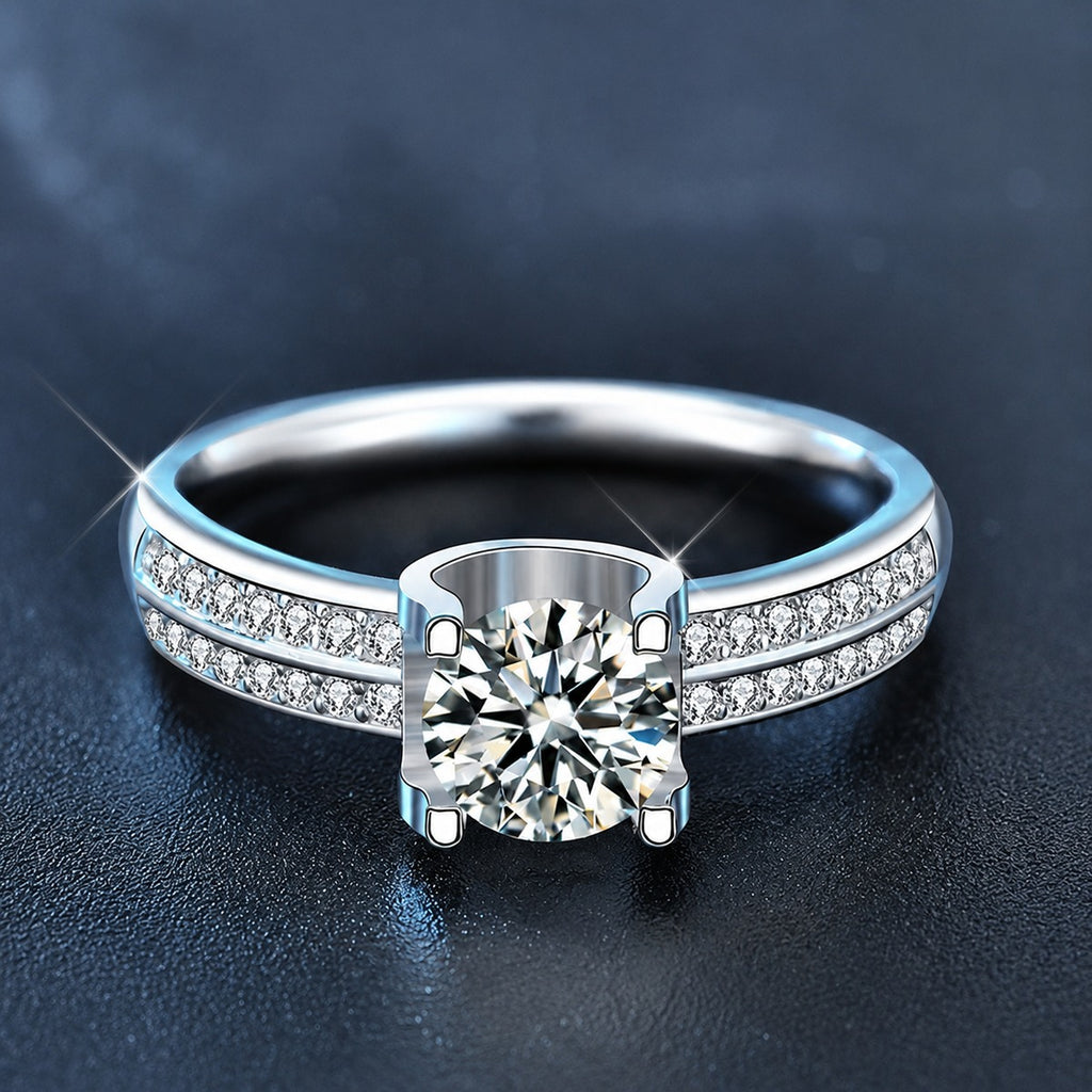 Four-Prong Round Moissanite Engagement Ring with CZ product view showing moissanite setting and metal finish