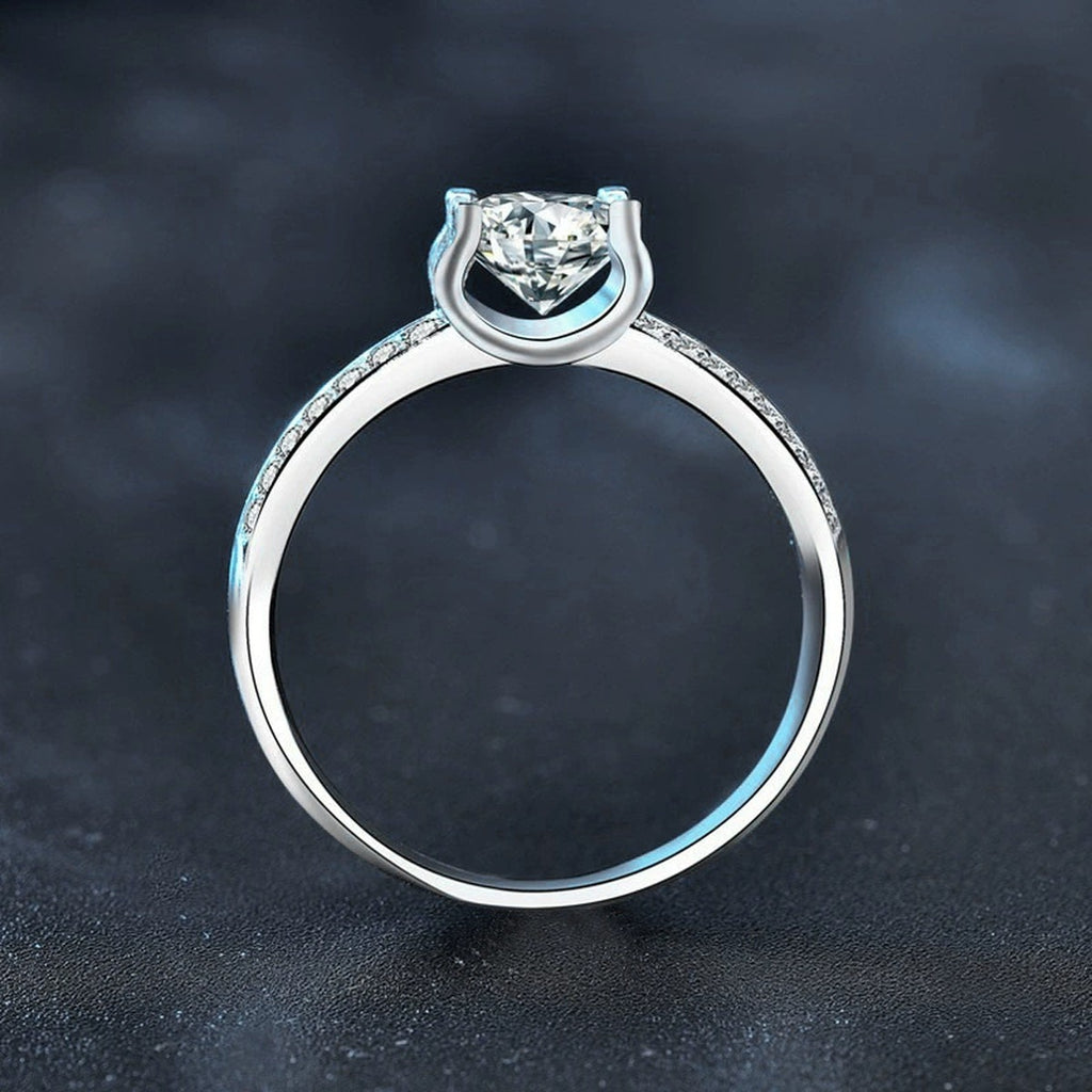 Four-Prong Round Moissanite Engagement Ring with CZ product view showing moissanite setting and metal finish