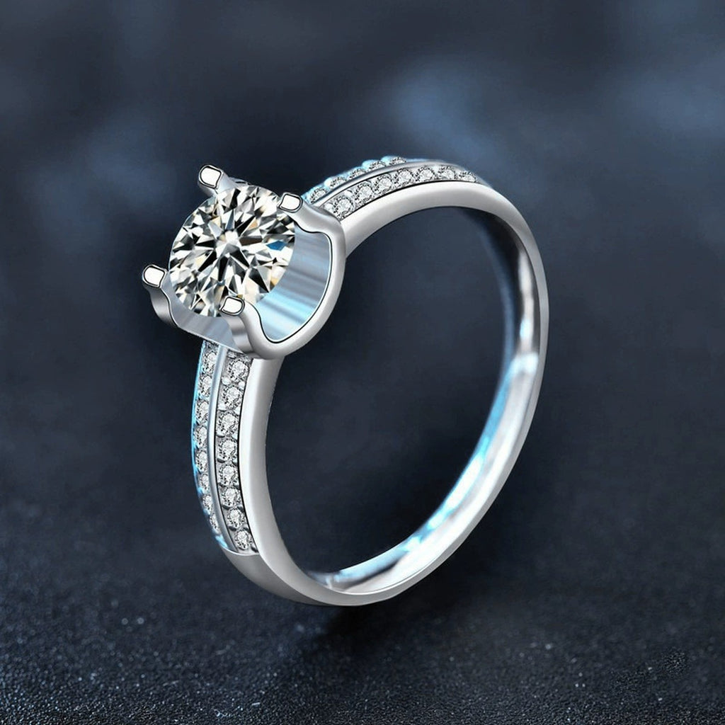 Four-Prong Round Moissanite Engagement Ring with CZ product view showing moissanite setting and metal finish