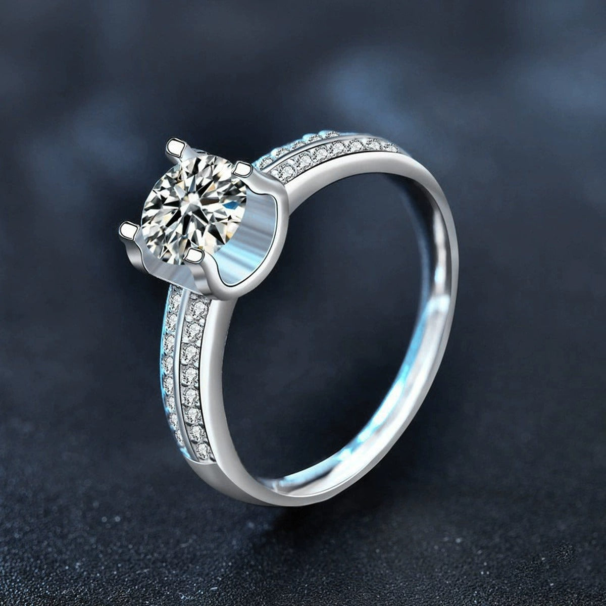 Four-Prong Round Moissanite Engagement Ring with CZ product view showing moissanite setting and metal finish