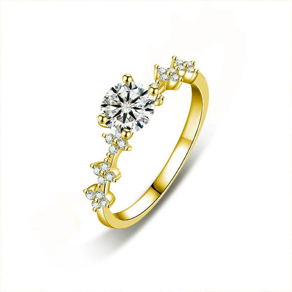 Four-Prong Round Moissanite Engagement Ring with CZ in gold-plated S925 sterling silver on clean white background