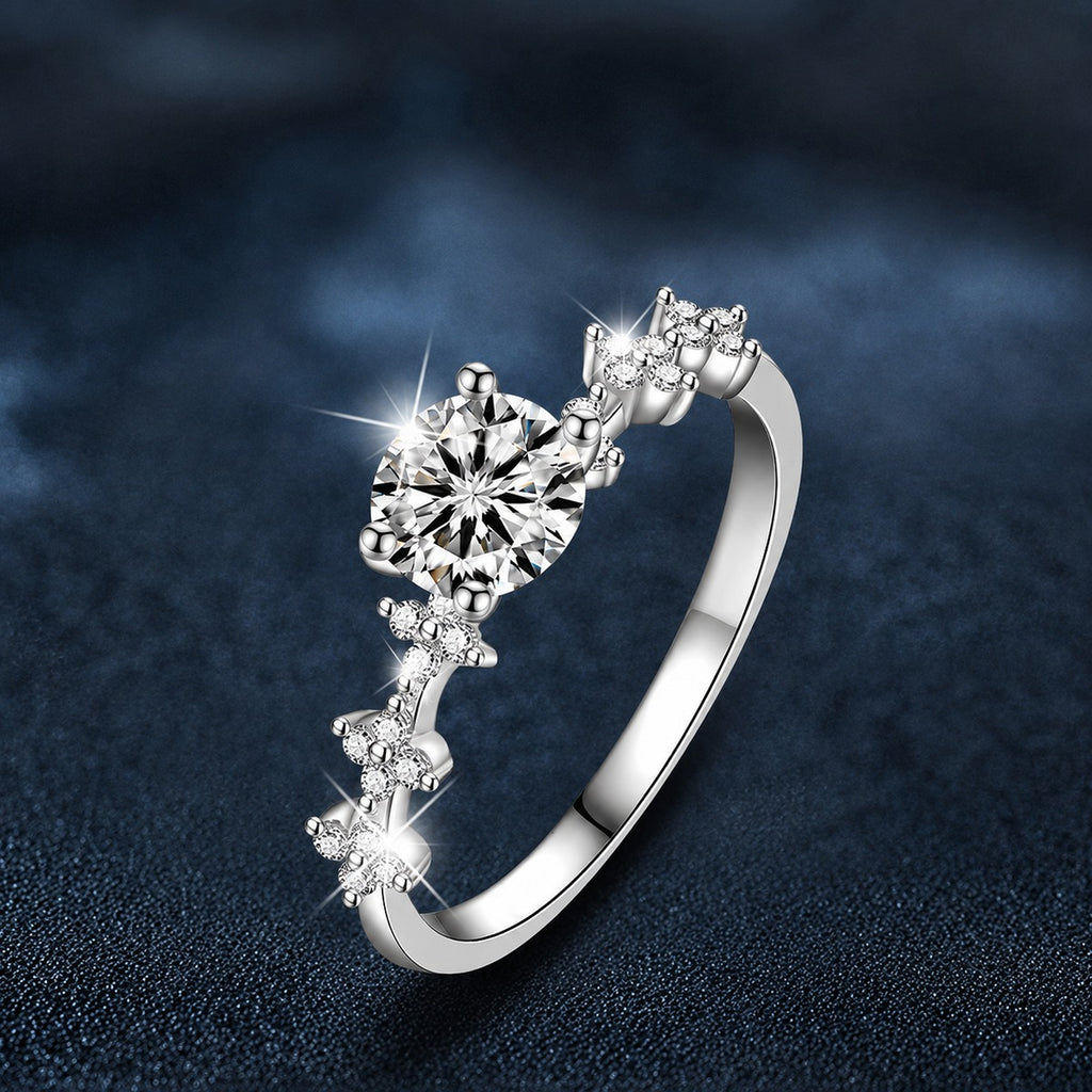 Four-Prong Round Moissanite Engagement Ring with CZ close-up detail view with moissanite sparkle