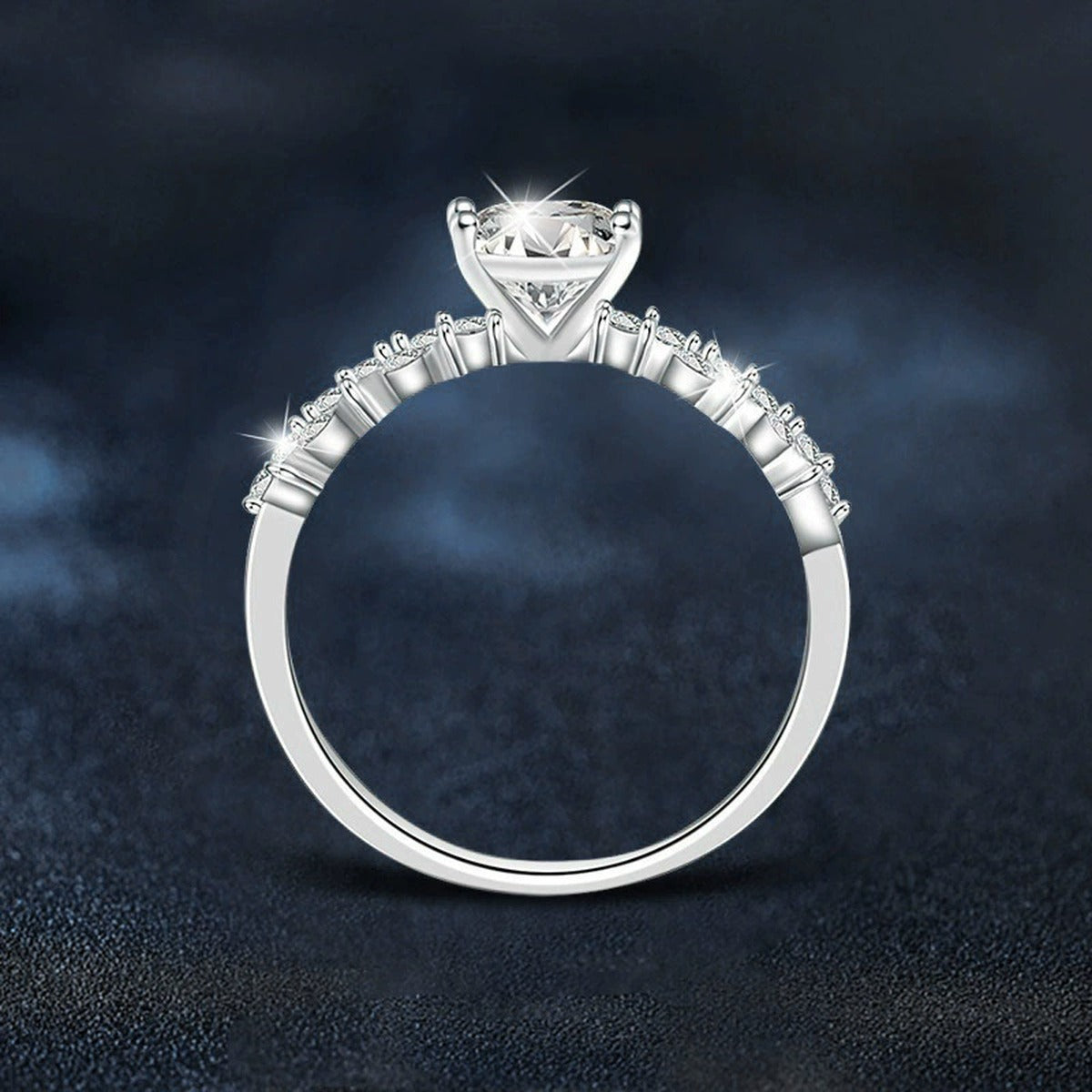 Four-Prong Round Moissanite Engagement Ring with CZ close-up detail view with moissanite sparkle