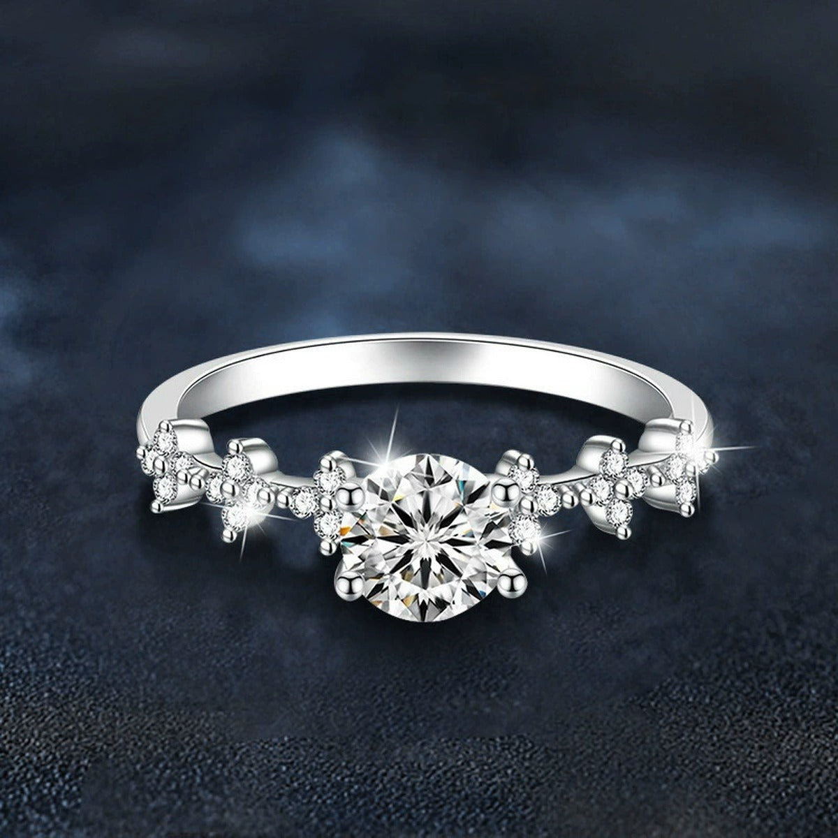Four-Prong Round Moissanite Engagement Ring with CZ close-up detail view with moissanite sparkle
