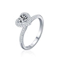 Heart Motif Three-Prong Round Moissanite Engagement Ring with CZ in white gold-plated S925 sterling silver on clean white background