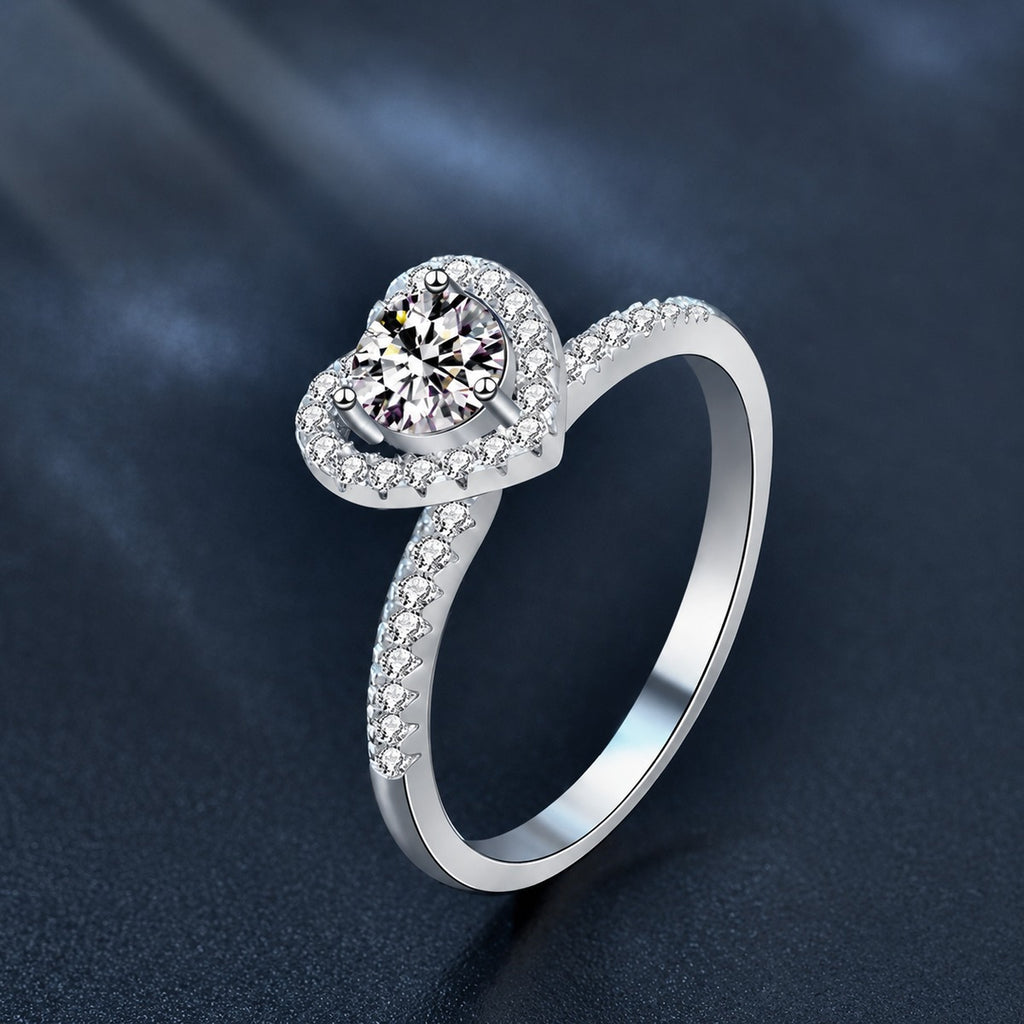 Heart Motif Three-Prong Round Moissanite Engagement Ring with CZ close-up detail view with moissanite sparkle