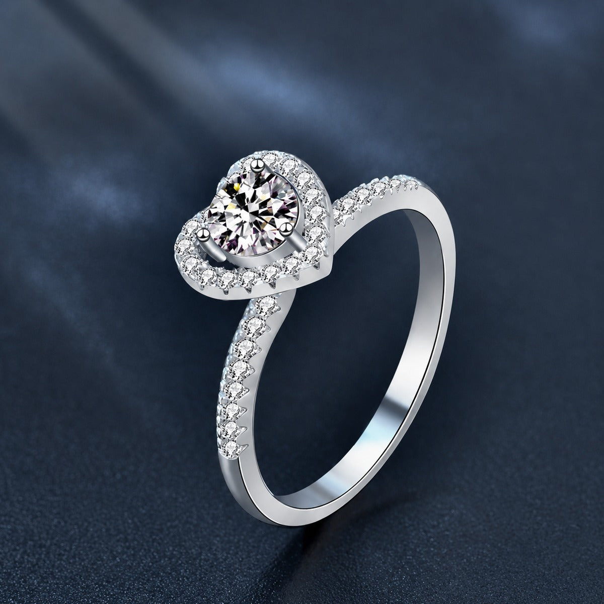 Heart Motif Three-Prong Round Moissanite Engagement Ring with CZ close-up detail view with moissanite sparkle