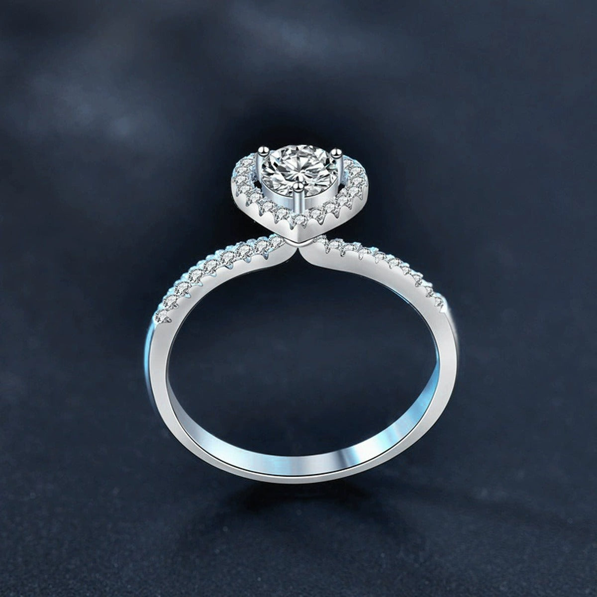 Heart Motif Three-Prong Round Moissanite Engagement Ring with CZ close-up detail view with moissanite sparkle