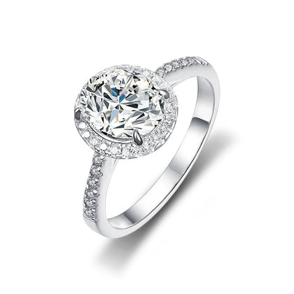 Oval Cut Moissanite Halo Engagement Ring with CZ in white gold-plated S925 sterling silver on clean white background